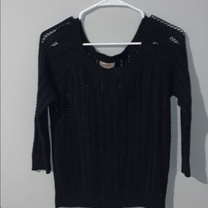 Black knitted sweater.
